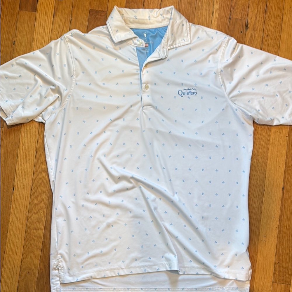 White Polo Golf Shirt with Blue Accents. Quintero